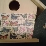 adding washi tape to the birdhouse